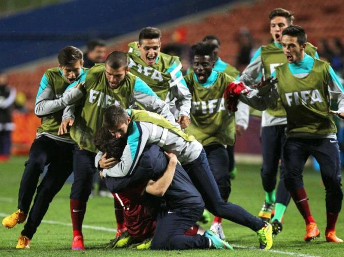 The Portuguese team celebrates with Nuno Santos, following the team's third goal.
